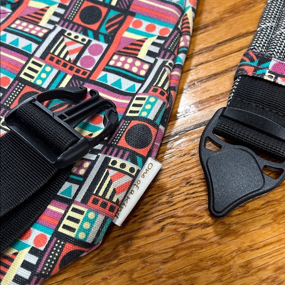 Kavu sling bag backpack in geometric print of Spring Montage.  Good condition.